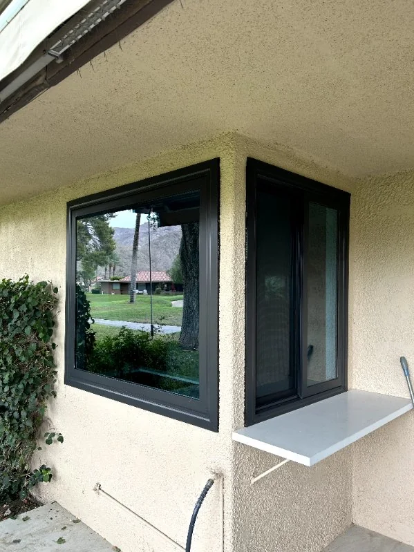 Black corner windows with a pass-through counter, RJ Construction