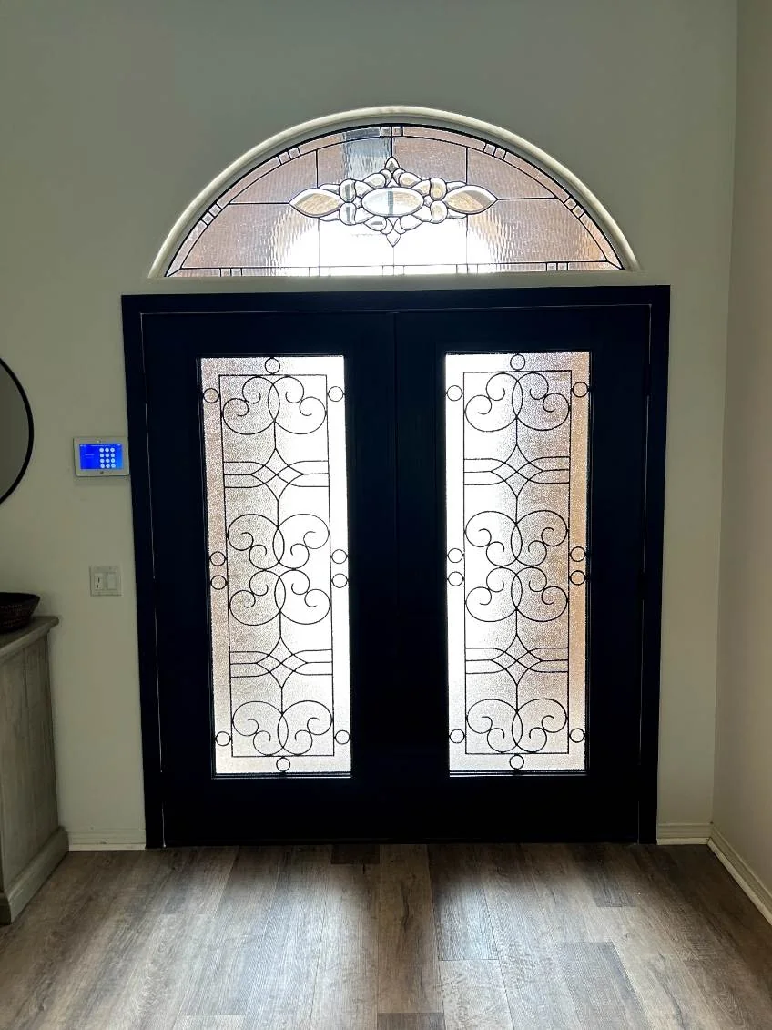 Black double doors with wrought iron glass, RJ Construction