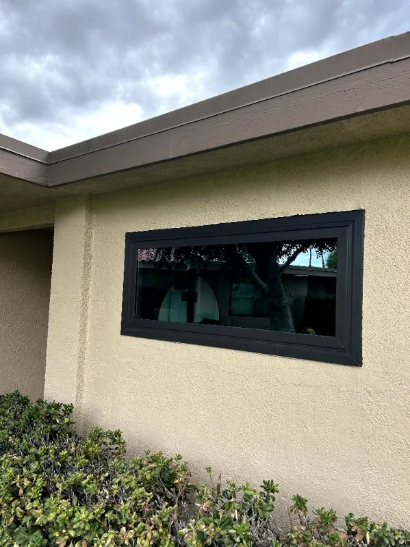 Wide black slider window, RJ Construction