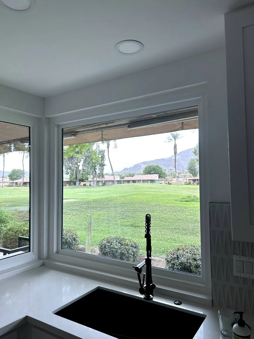 White corner windows over the sink, RJ Construction